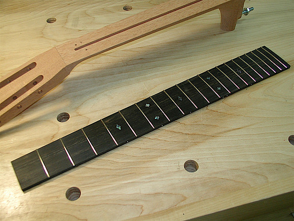 Fretboard with Squared Fret Edges