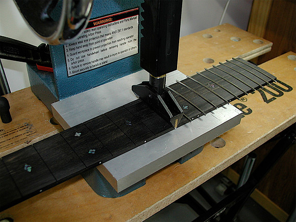 Pressing Frets